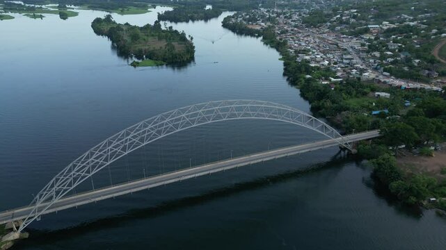 Drone shot of Boat cruise under the Adomi Bridge in Akosombo, Ghana
