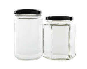 Two empty glass jars isolated on white