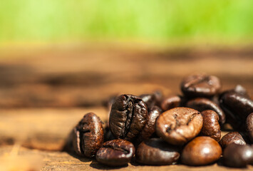 Coffee beans roasted on a wooden floor.