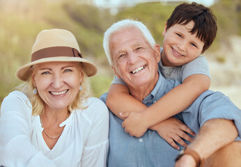 Fototapeta premium Family, portrait of grandparents or happy boy at beach for summer fun, bonding or support in nature. Seniors, young child or smile with hug for care, relationship development and trust in Australia
