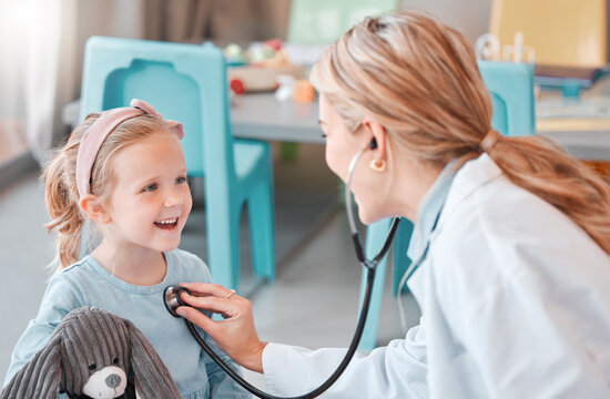 Healthcare, child and doctor for checkup with stethoscope, wellness and health for sound with smile. Hospital, female pediatrician and girl for medical exam, heart rhythm and respiratory wellbeing