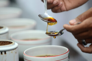 Detailed photo of tea drops tasted by a tea taster