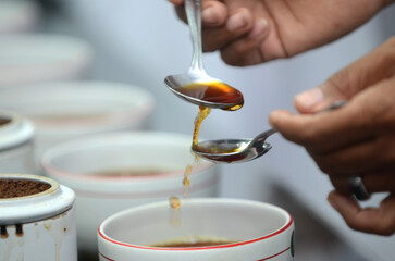 Detailed photo of tea drops tasted by a tea taster