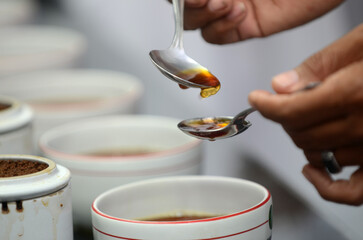 Detailed photo of tea drops tasted by a tea taster