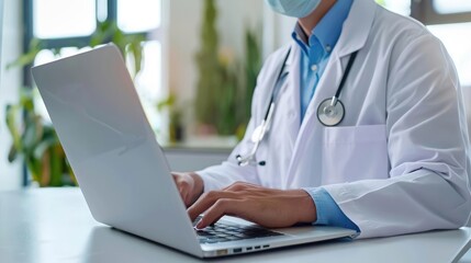 Doctor at laptop in clinical setting, medical technology, healthcare advancements, rear perspective