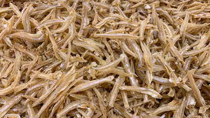 Top view of anchovies displayed in supermarket. Dry seafood concept.