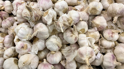 Top view of garlic displayed in supermarket. Healthy food concept
