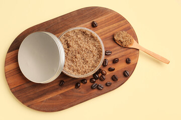 Wooden board with jar of body scrub and coffee beans on color background