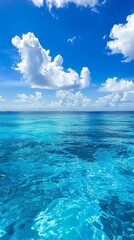 Fototapeta premium Tranquil Seascape: The Enchanting Beauty of a Pristine Blue Ocean Background, Exuding Serenity and Timeless Elegance.