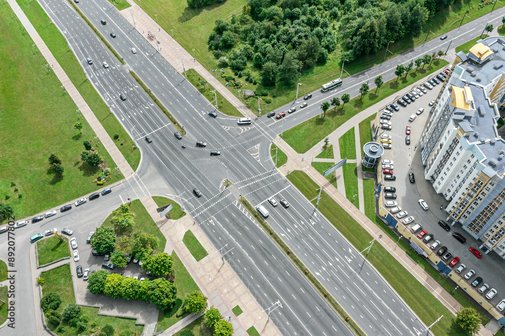 Wall mural aerial view of intersection of the road with cars traffic in urban residential area.