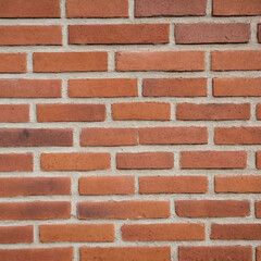 Fototapeta premium Orange brown red brick wall. Texture of old dark brown and red brick wall.