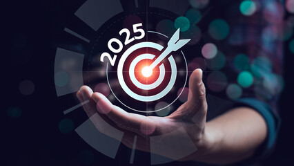 Business goal setting and future planning concept for 2025 with businessman holding digital target and dart. Strategic planning, success achievement, vision, mission, and leadership objective.