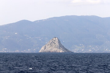 View from the deck of a steamship on a small island in the Aegean Sea.