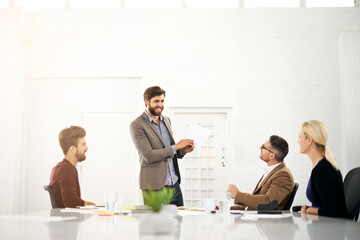 Businessman, coach and talking with team for meeting, presentation or collaboration at office. Man or speaker explaining to group of employees for company proposal, planning or ideas at conference