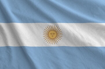 Argentina flag depicted on folded wavy fabric of old cloth close up