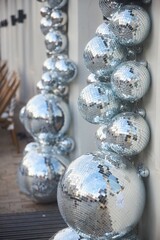 A large mirror with a silver ball decoration on it.