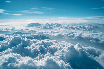 White, fluffy clouds stretch out across a blue sky ,  bird view, view from porthole 