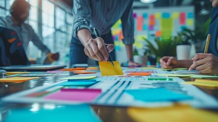 Business team planning a new strategy with colorful sticky notes