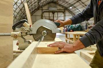 Wood wooden modular houses made of timber yellow board saw processing hands nail grind