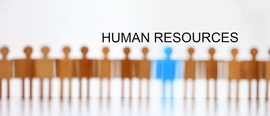 Human resources sign above line of toy human figures concept