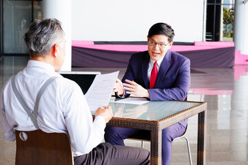 Businessmen sit and discuss work and make business plans in the office.