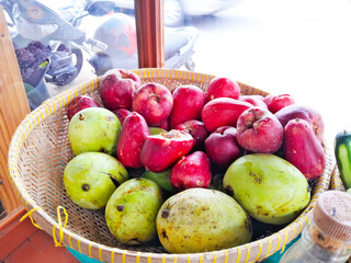 photo of various types of tropical fruit in a basket