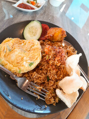photo of fried rice with delicious and tempting omelet