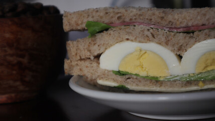 wheat sandwiches with sliced ​​egg served on a plate