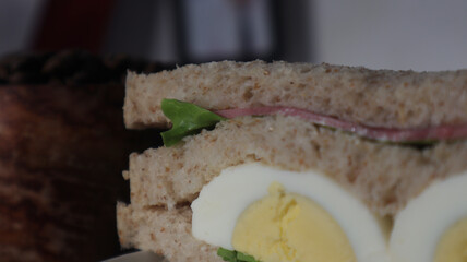 wheat sandwiches with sliced ​​egg served on a plate