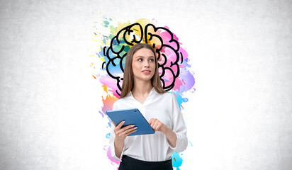 Woman holding tablet with colorful brain illustration in backgro