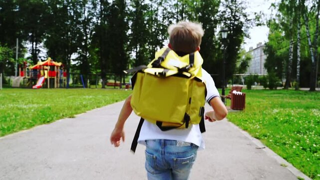 a first grader walks or runs to school with a backpack