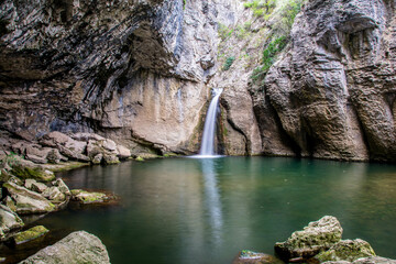 Hidden waterfall between the rocks in Emen canyon near Veliko Tarnovo. Momin Skok waterfall © Marin
