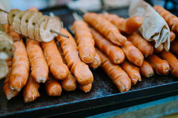 Grilled sausages sizzling on the barbecue, showcasing a delicious and savory treat perfect for outdoor gatherings