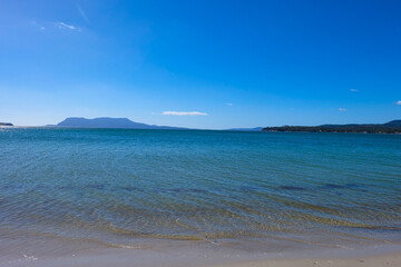 Crystal clear water sea ocean beach stop along the way to Freycinet national park, Tasmania, Australia 