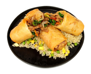 Jumbo shredded duck meat and vegetable filled spring rolls with egg fried rice isolated on a white background