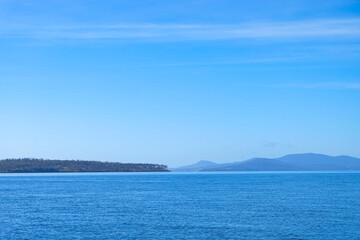 Crystal clear water sea ocean beach stop along the way to Freycinet national park, Tasmania, Australia 