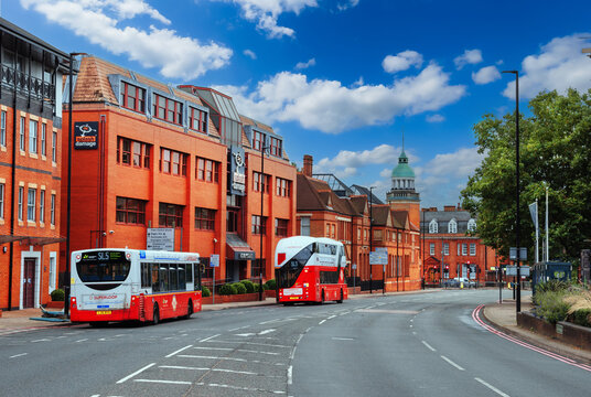 Bromley North, London, England - July 21, 2024: Charming Bromley North: A Picturesque Road with Traditional British Brick Houses and Iconic Double-Decker Buses on the Windmore Road