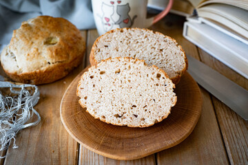 Homemade rye bread on a wooden background. Slices of rye bread on a wooden board. Close-up