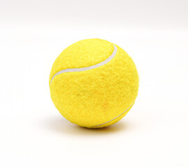 A Close-Up Photo Of A New, Vibrant Yellow, Textured Tennis Ball Showcasing Under Bright Lighting