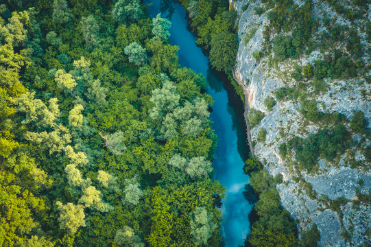 Top view of Panega river flowing through around the rocks, near Lukovit, Bulgaria. Drone photography

