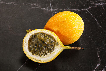 Yellow granadilla with cut half