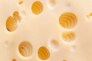 Yellow cheese with holes before serving