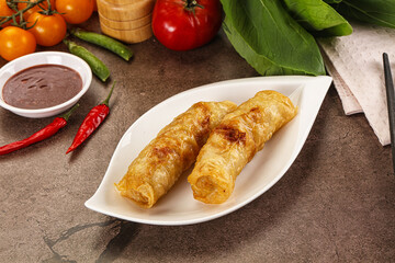 Vietnamese stuffed spring roll served sauce