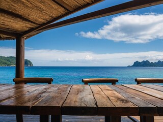 Scenic view wooden table with sea, island, and blue sky in the background