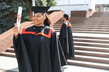 pretty african female college graduate at graduation