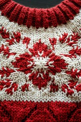 Red and white knitted sweater pattern with beautiful intricate design.