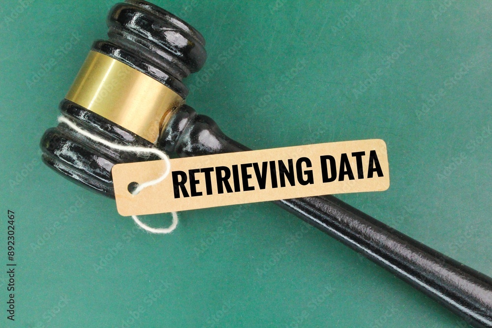 Poster judge's hammer and paper tag with the word retrieving data.