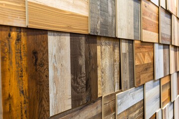 Display of square-shaped wood laminate and vinyl tile samples.