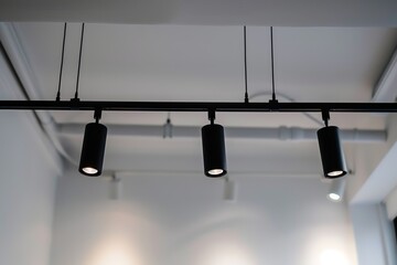 Close-Up of Black Track Lighting System in Modern Home Interior Design