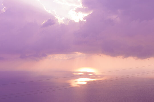 Colorful sunset on the sea. The rays of the sun illuminate the sea surface.